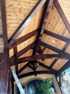 Stained timber trusses and wood ceiling finished by All Seasons Painting