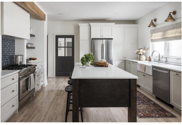 Refinished kitchen cabinets with a smooth sprayed finish in a bright modern kitchen
