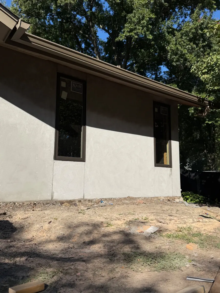 New stucco and windows on a Kansas City home, prepped and ready for priming and paint